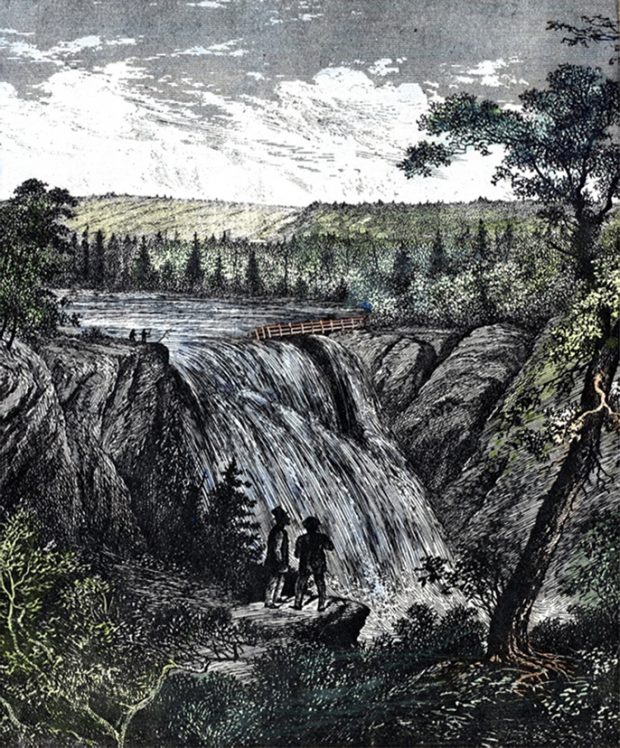 Lithograph engraving of the Mitis River Falls. The 90 feet waterfall is represented in the center of the composition. On each side of the waterfall there is a steep rock face and a forest canopy. On the right side a footbridge allows you to approach the top of the waterfall. Two men can be seen silhouetted on the left side of the waterfall standing on a rock cape. In the foreground, two men observe the waterfall from a rock.