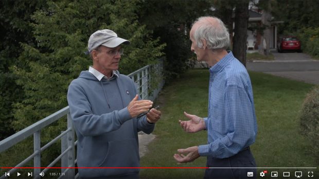 Jocelyn Duff and Jean Poitras discuss the origin of a nail found by the latter.