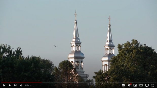 Behind the trees, the Church of the Visitation’s two steeples.