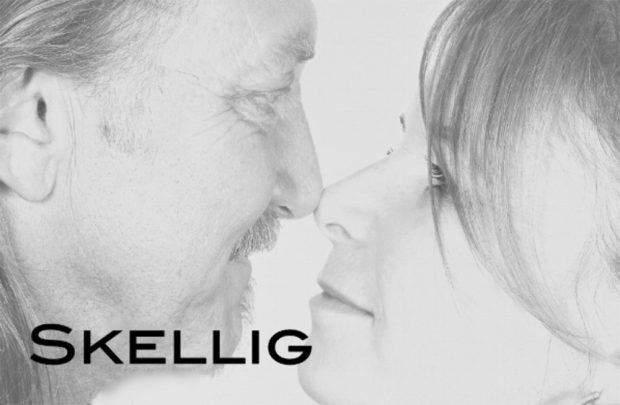 Black & White album cover with close up of man and woman touching noses.