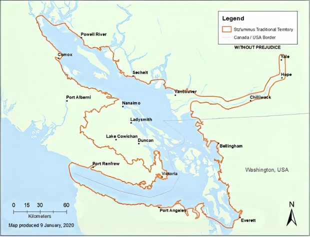 Map showing southeastern Vancouver Island and adjacent mainland in green with sea in blue overlain with the boundary of the traditional territory of the Coast Salish Stz’uminus First Nation outlined in brown.