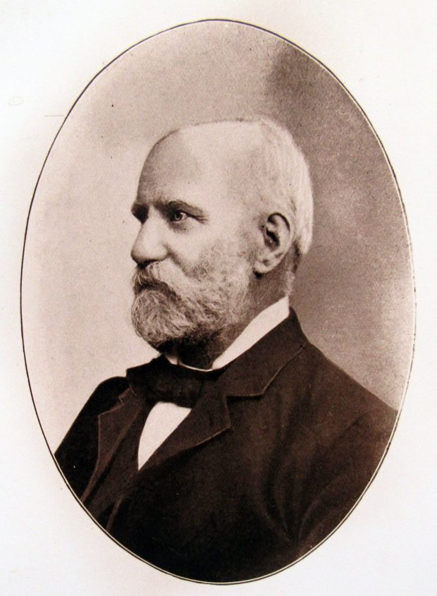 A sepia-coloured portrait of H. B. Witton taken later in his life. He is formally dressed with a trim, white beard. The portrait is taken in profile.