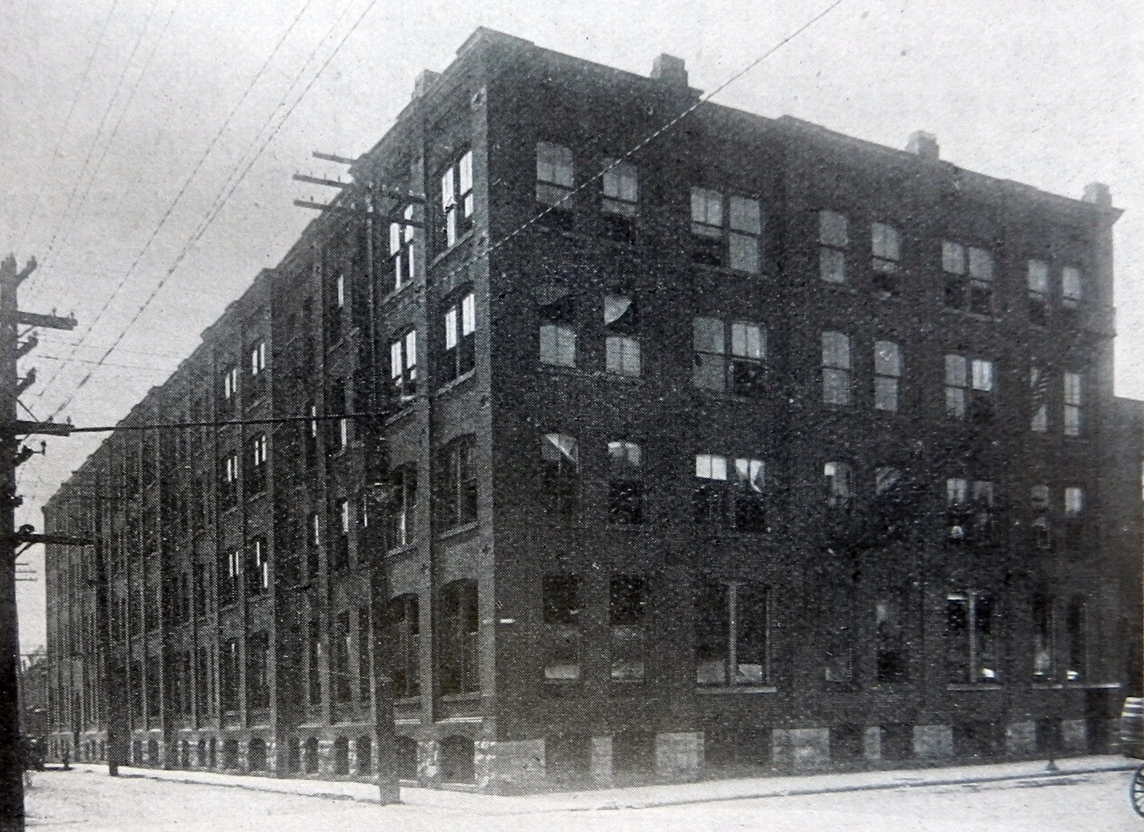 A photograph of John McPherson's four-storey factory, which occupies almost a full city block.