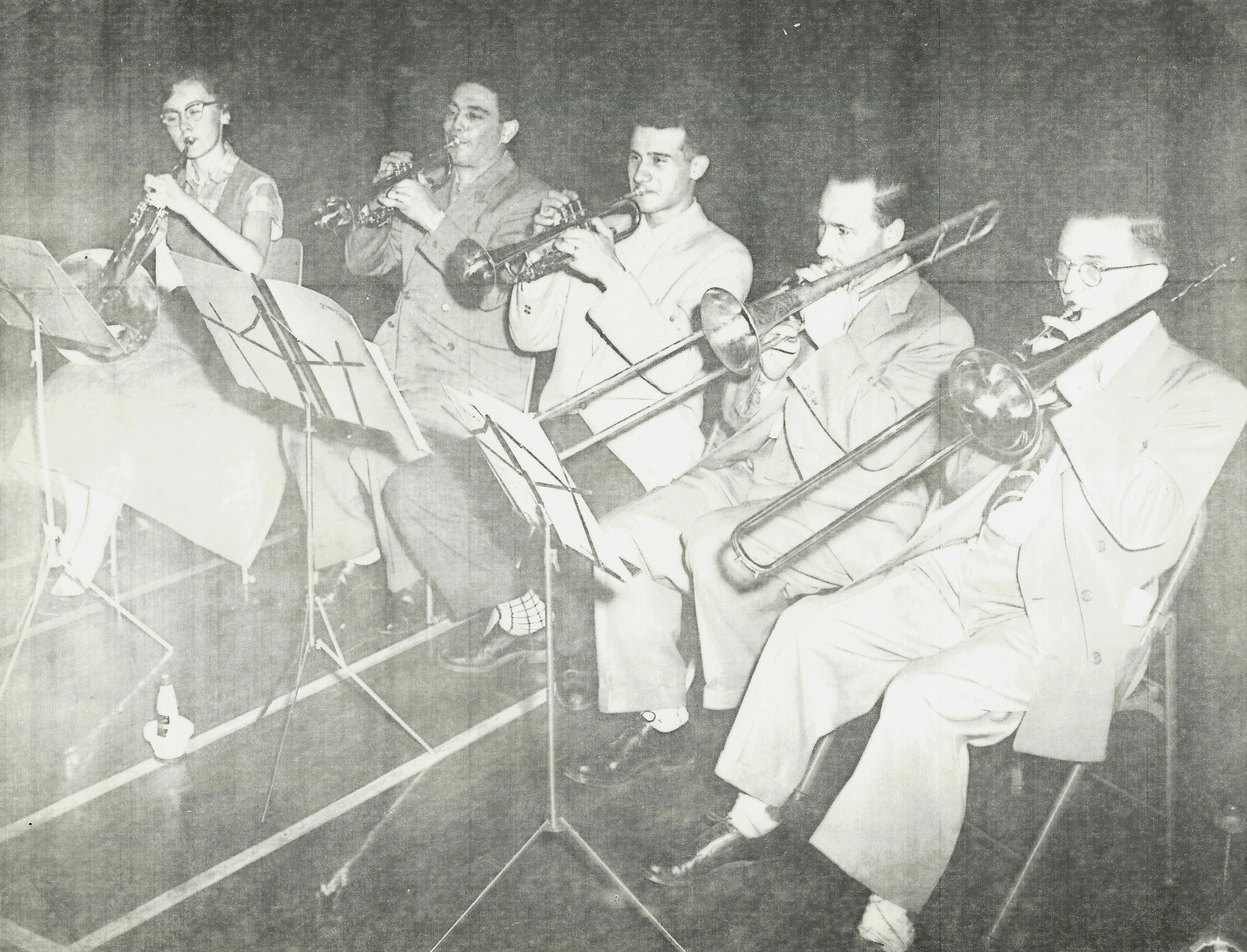 5 brass players in rehearsal