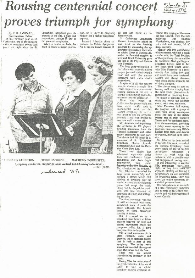 Leonard Atherton, Terri Pothier, and Maureen Forrester look over music on stand. Newspaper article titled Rousing centennial concert proves triumph for symphony