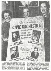 3 members of women's committee hold membership poster