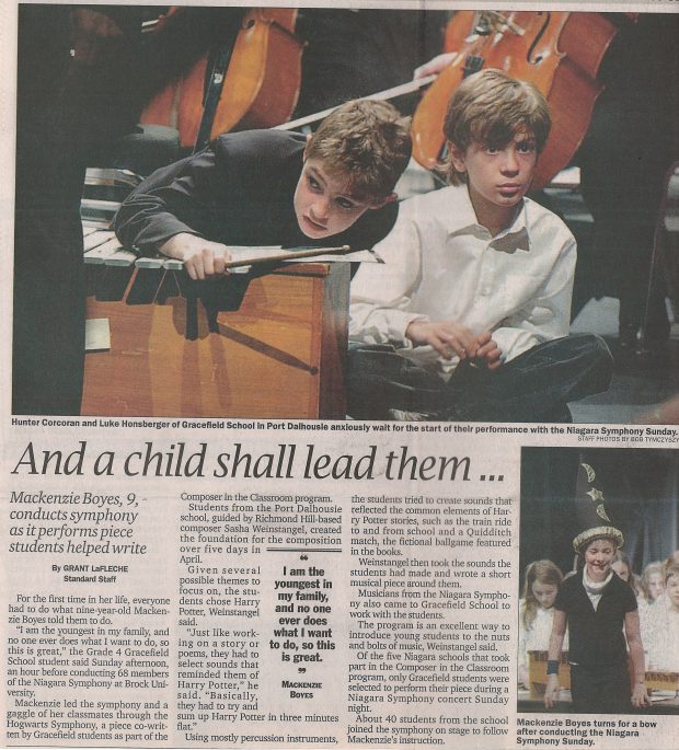 Two students sit at a xylophone on stage. Newspaper article titled And a child shall lead them...