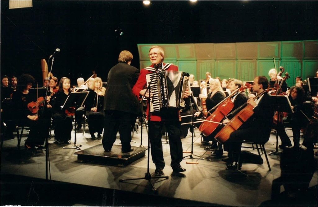 Walter Ostanek plays accordion with orchestra