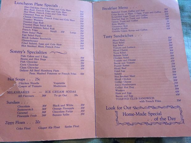 Printed menu on folded sheet listing food items and prices.