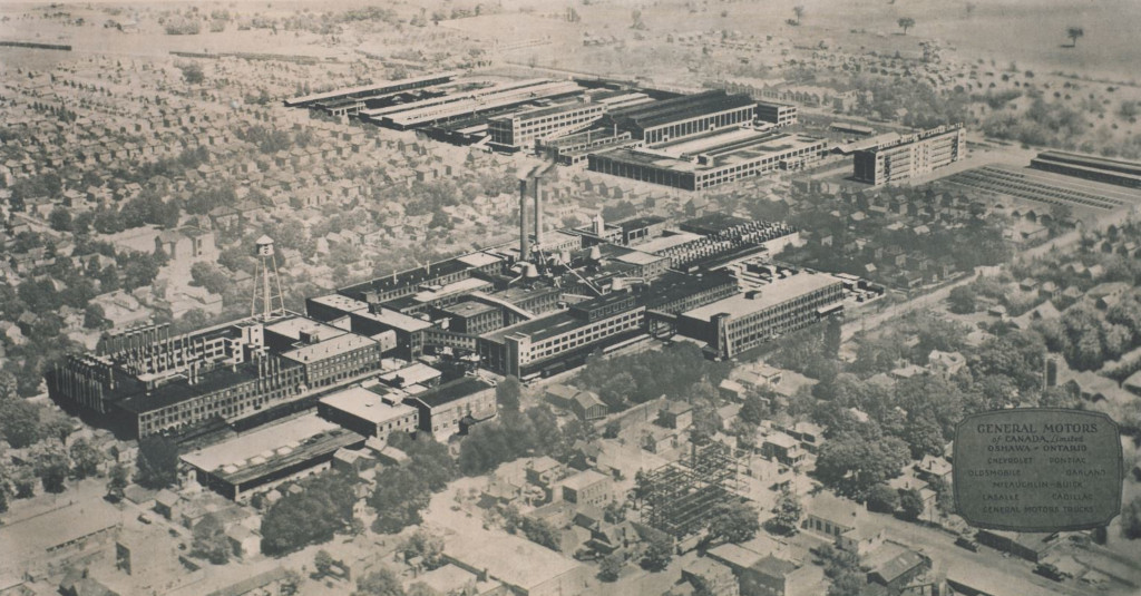 An aerial photograph of a series of factory buildings. The buildings have been edited to highlight them against the background.