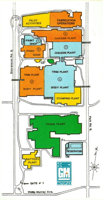 A stylized map of a series of factory buildings seen from above, with road connections. A label reads GM Autoplex.