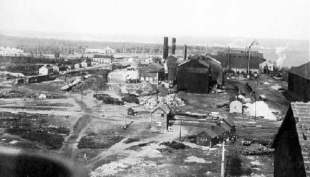 Aerial view of steel plant, smoke stacks and buildings.