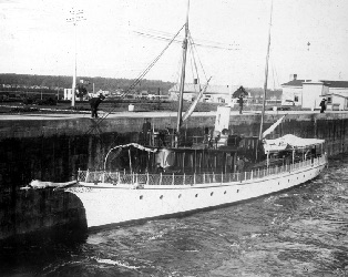 Long white yacht docked on the river