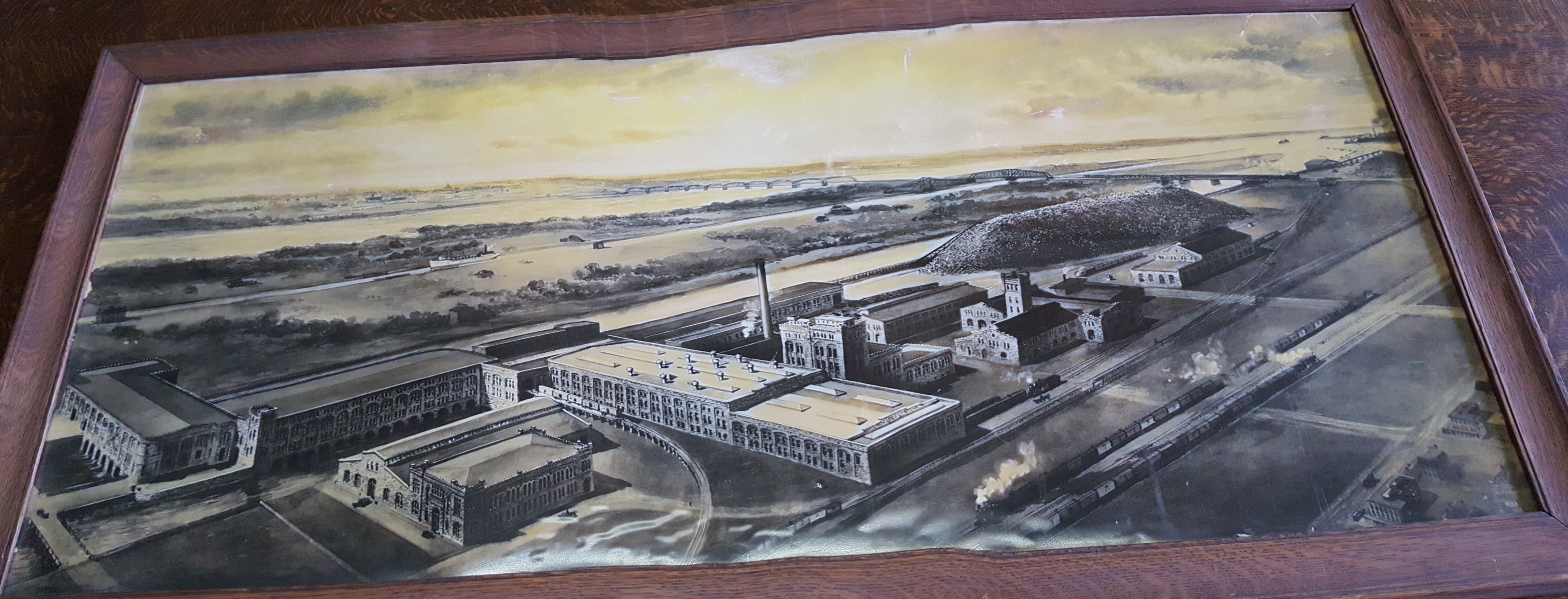 Photograph of a framed concept drawing of the mill.