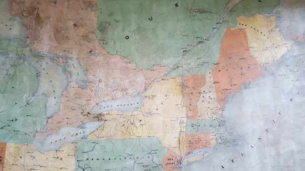 Colourful hand painted wall map of the Great Lakes, Quebec, Ontario, the Atlantic Ocean and north eastern United States, from 1901.