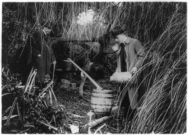 Two policemen discover a still