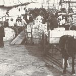 Unloading cases of champagne in Saint-Pierre-and-Miquelon.