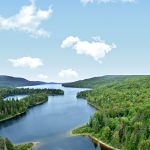 The meeting point of the three borders is on Beau Lake, Rivière-Bleue.