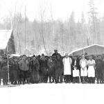 A group of workers in a logging camp