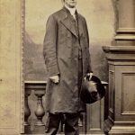Full length studio portrait of Bishop George Hills