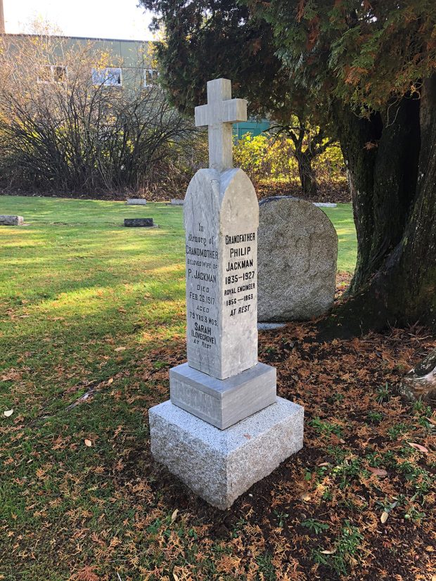 A photograph of a four-sided headstone in a graveyard. The left side of the headstone commemorates the life of Sarah Ann Lovegrove and the right side commemorates Philip Jackman.