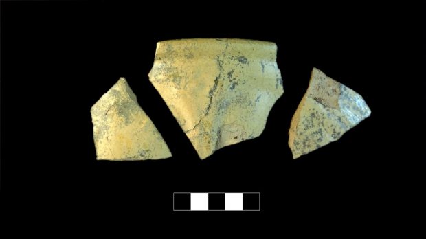 Three yellowish ceramic shards