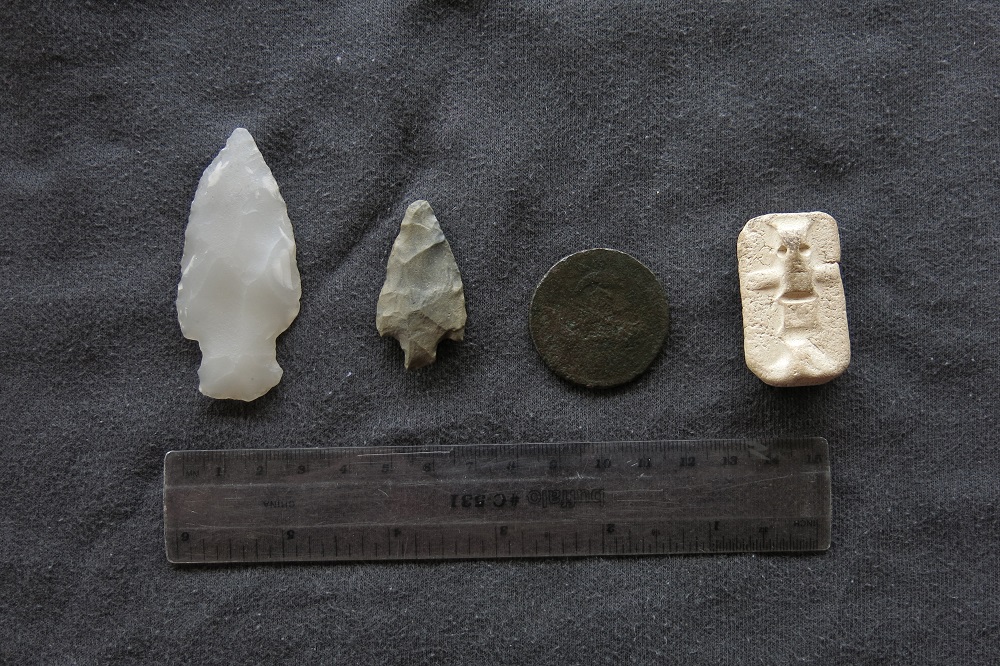 Two projectile points, one piece and another undetermined object