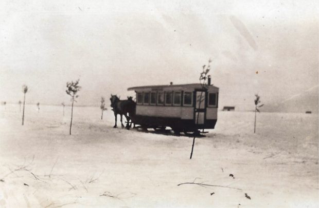 A streetcar drawn by horses on the ice