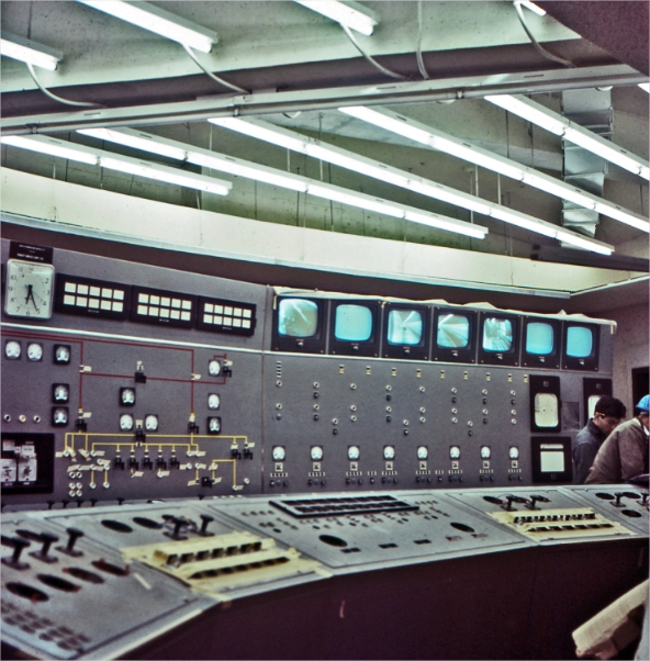 A control room with two men