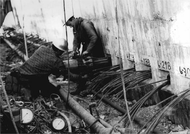 Construction workers working on a concrete structure