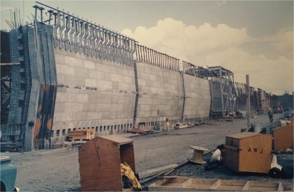 A structure under construction with various types of building materials all around