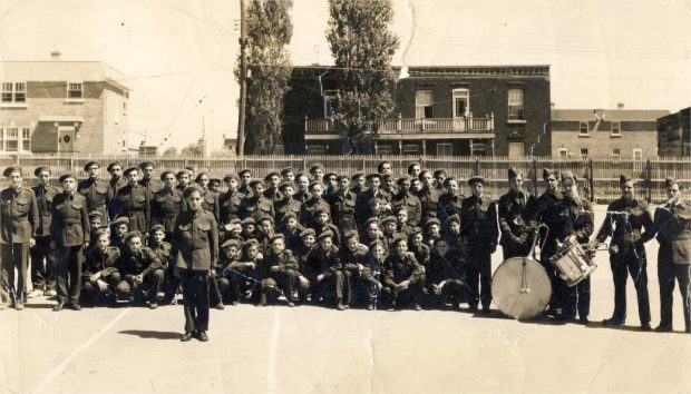 Children and teenagers gathered in a schoolyard