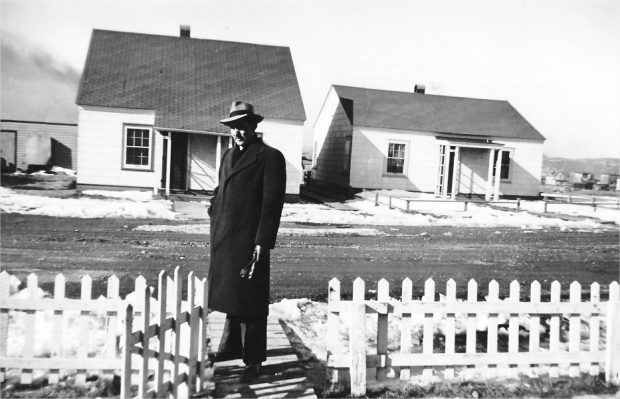 A man in front of single-family homes