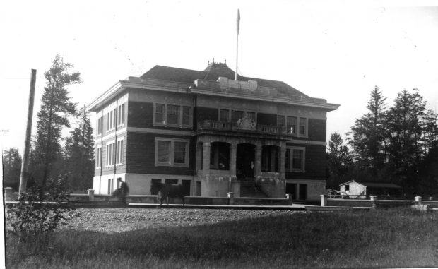 A large city hall in a field