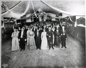 A group of well-dressed residents at a ball