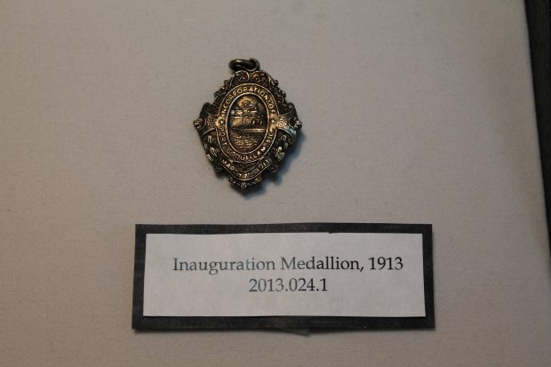 A decorative silver medallion