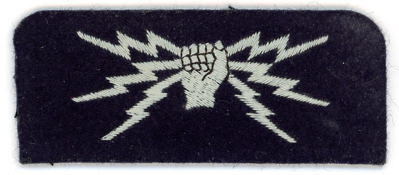 A dark blue felt patch with embroidered white fist holding 3 lightning bolts