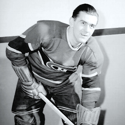 Black and white photograph of hockey player Maurice Richard in a Montreal Canadiens jersey.