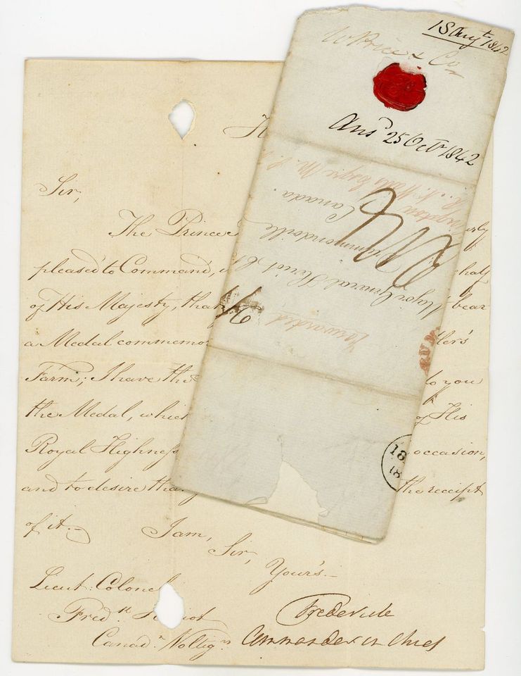 Colour photograph of a handwritten letter on time-yellowed paper, stamped with a red wax seal.