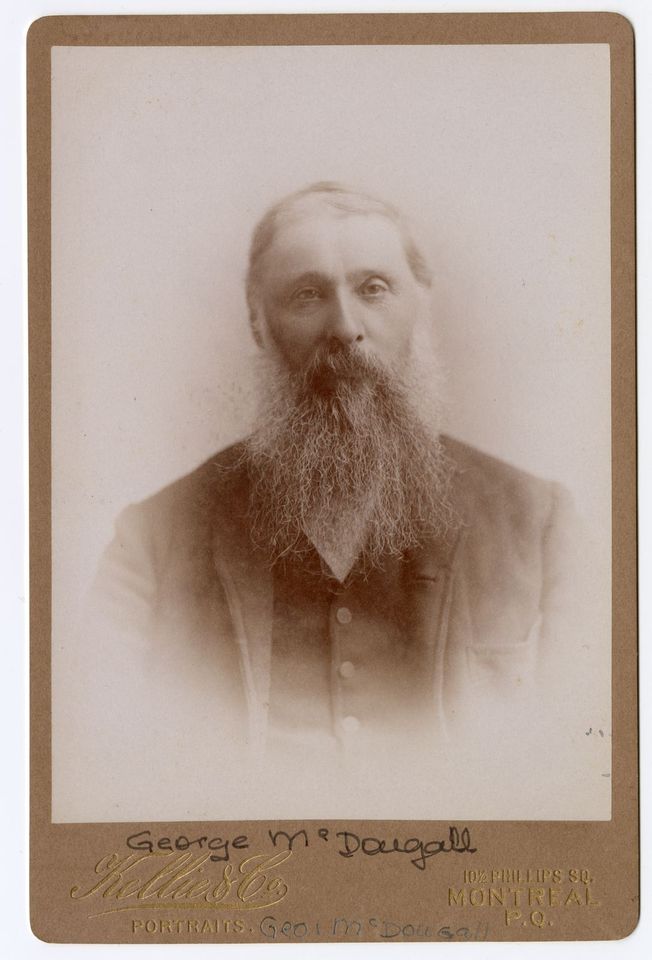 Black and white photograph of a man with a long beard wearing a jacket.