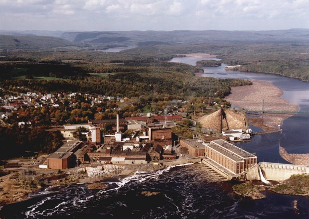 Aerial view of the plant site near the river and the dam