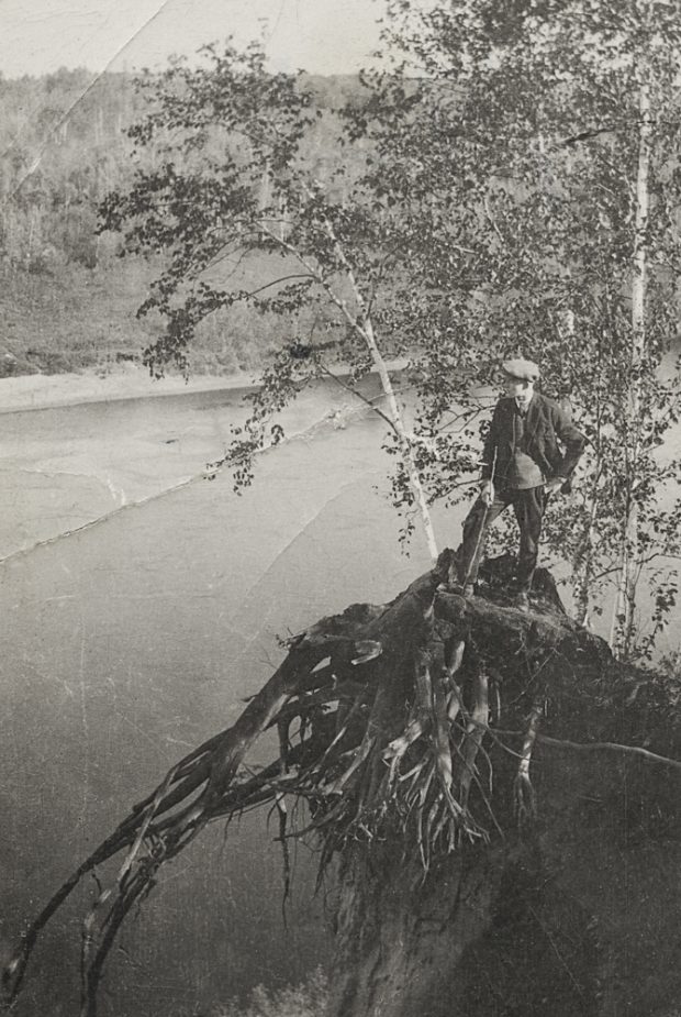 Frank Sutcliffe stands on a stump overlooking the river.