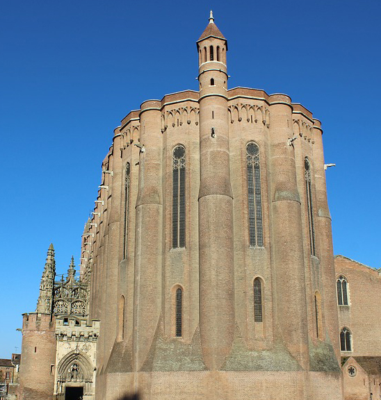 Sainte-Cécile Cathedral in Albi. The narrow windows are crowned with friezes and separated by semi-cylindrical buttresses.