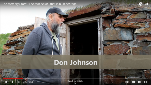 Bearded middle-aged man with cap looking through open door of a root cellar.