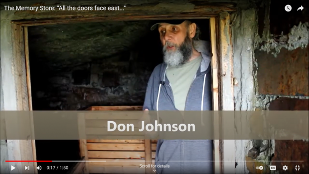Bearded middle-aged man with cap standing in the open doorway of a root cellar.