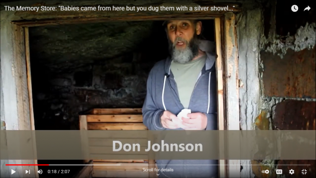 Bearded middle-aged man with cap standing in the open door of a root cellar.