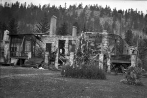 Black and white photo of a stone building after a fire.