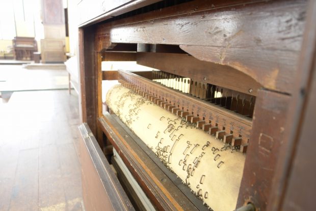 A close up view of the mechanical organ built in 1820 by Richard Coates and used by the Children of Peace in the First Meeting House. The staples raise the wooden hammers which in turn bring the music from the set of pipes.