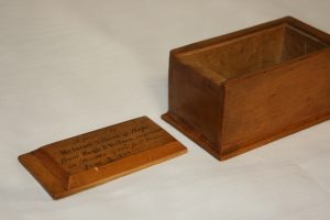 This rebellion box made of hard maple by Hugh D. Willson for Mr. Israel Willson of Hope. Hugh hand made the box, varnished with a sliding lid, and engraved it while imprisoned in Toronto Gaol for High Treason in 1838.