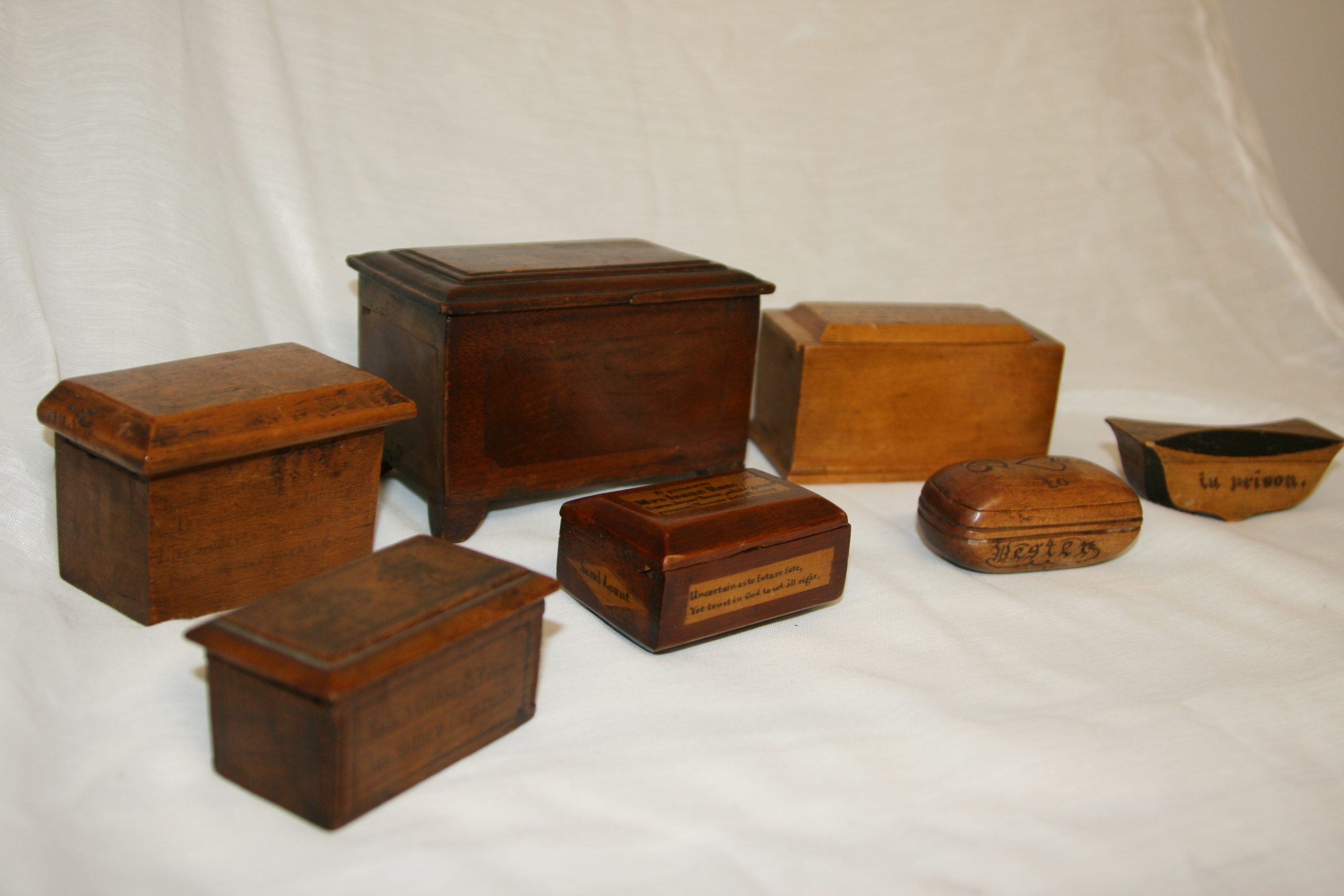 The seven rebellion boxes made by imprisoned rebels that are in the Sharon Temple's collection.